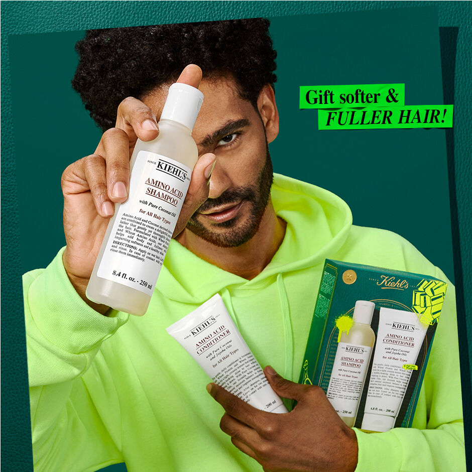 model holding shampoo and conditioner. give the gift of fuller hair! 