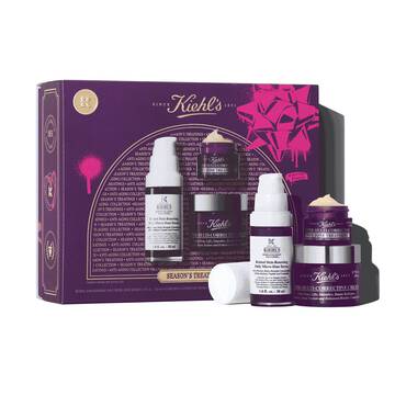 A graphic featuring a rectangular purple and pink Kiehl's "SEASON'S TREATINGS ANTI-AGING COLLECTION" gift set box, in front of the box there is a white and purple bottle of Retinol Skin-Renewing Daily Micro-Dose Serum, a small purple jar of Super Multi-Corrective Eye Zone Treatment, and a larger purple jar of Super Multi-Corrective Cream.