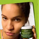 model holding face mask 