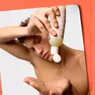 model squeezing out body cleanser into hand 