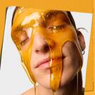 model with face wash dripping over face 