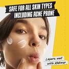 SPF product swipe on models cheek: Safe for all skin types including acne prone. Layers well with makeup