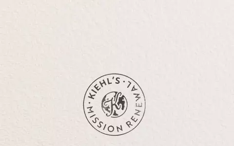Kiehl’s Mission Renewal banner featuring a circular stamp logo and text reading, "Our imperfect journey to drive a more circular economy," promoting the brand's sustainability and circular economy initiative.