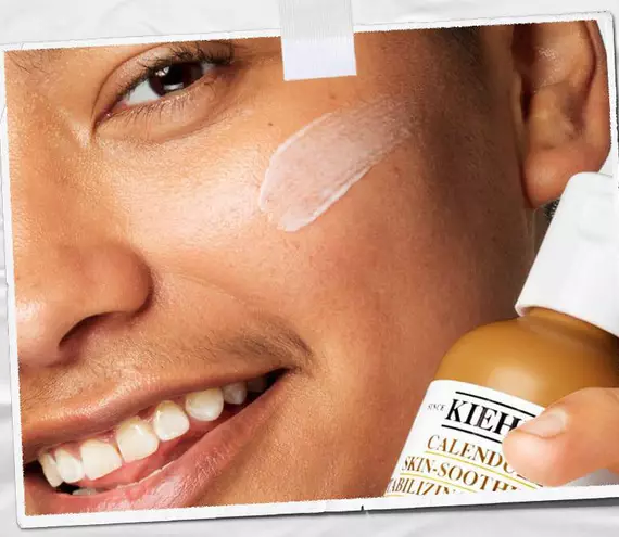 Model with Calendula Skin-Smoothing & Stabilizing Emulsion on their cheek