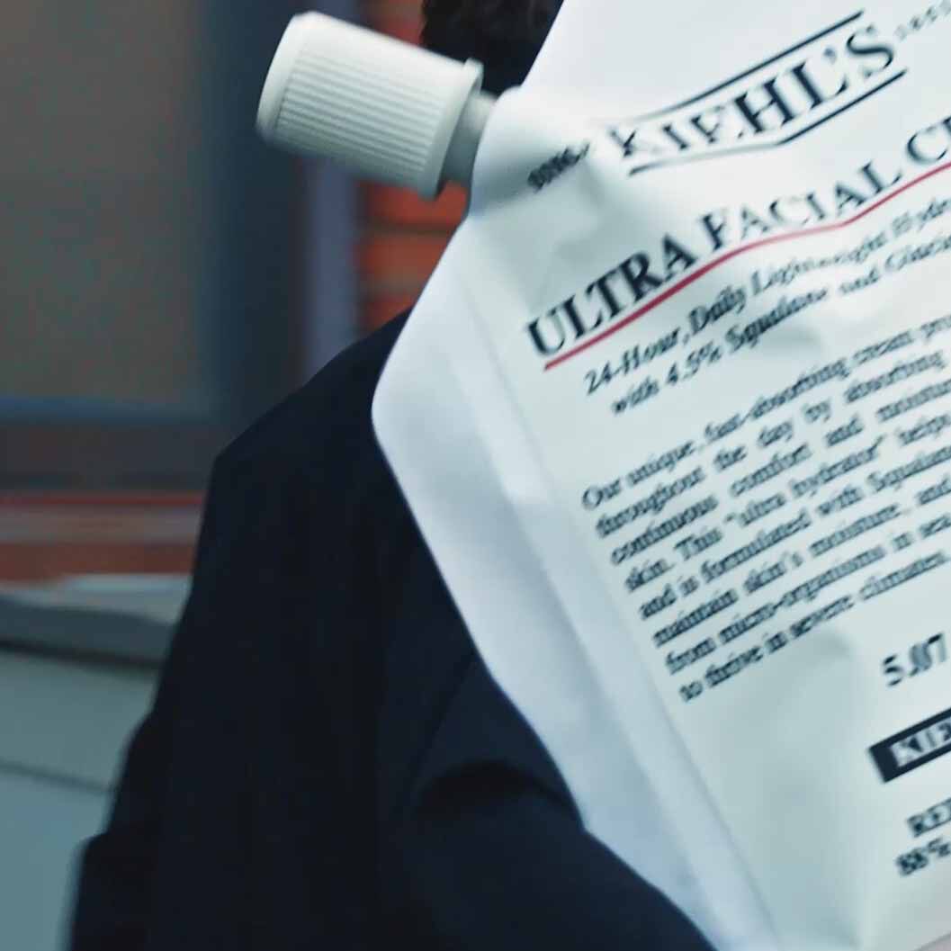 Close-up of a Kiehl’s Ultra Facial Cream refill pouch, highlighting 4.5% Squalane and lightweight hydration, promoting the brand’s sustainable, eco-friendly packaging initiatives.​