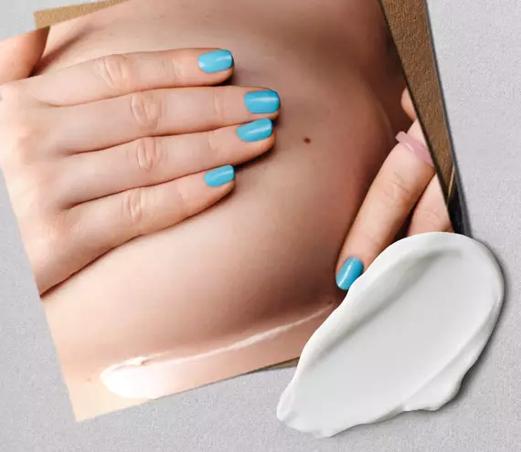 model adding cream to powder deodorant under chest area