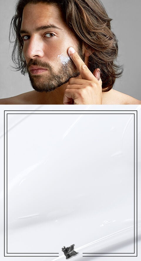 A man putting a face cream on