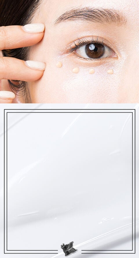 A woman with eye cream underneath eye