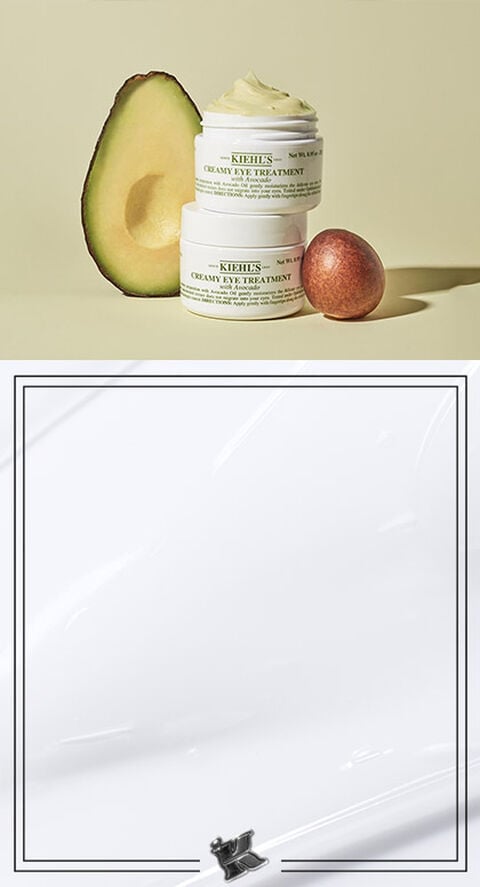 A photo of an avocado next to Kiehl's Creamy Avocado Eye Cream