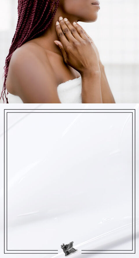 A woman lightly touching her neck.