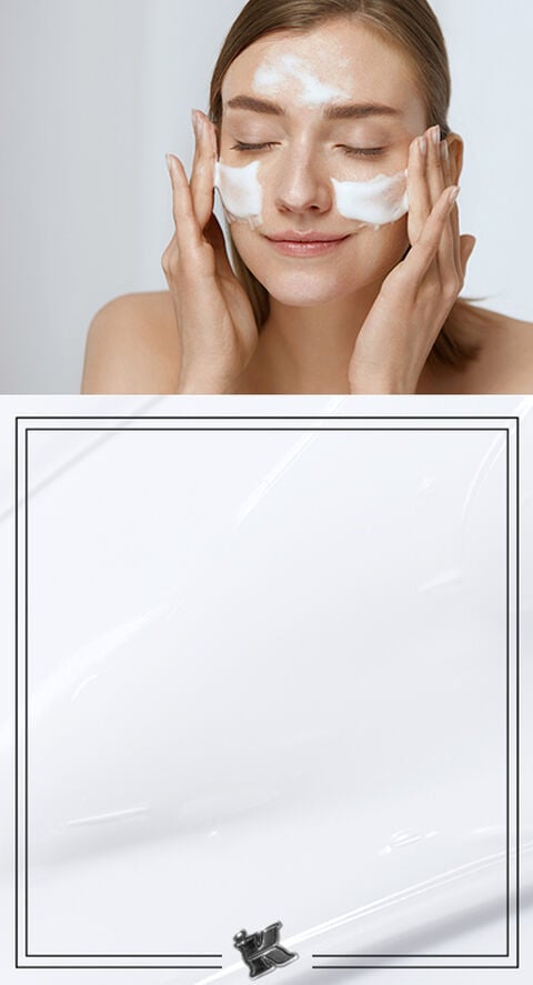 woman applying sunscreen to face