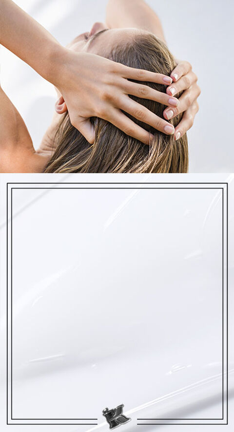 Someone running their hands over wet hair