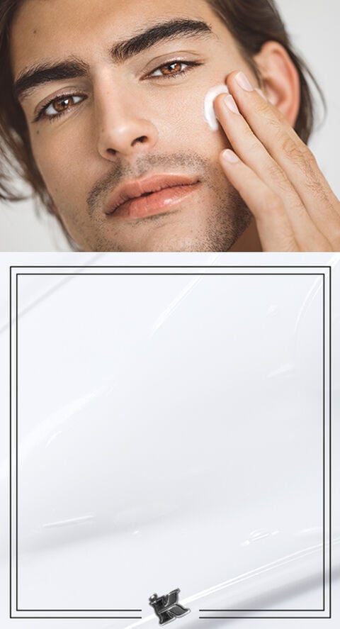 A man rubbing a cream into his face