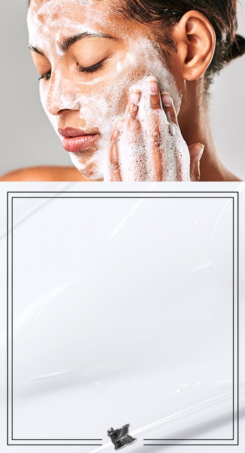 A woman using a foaming facial cleanser