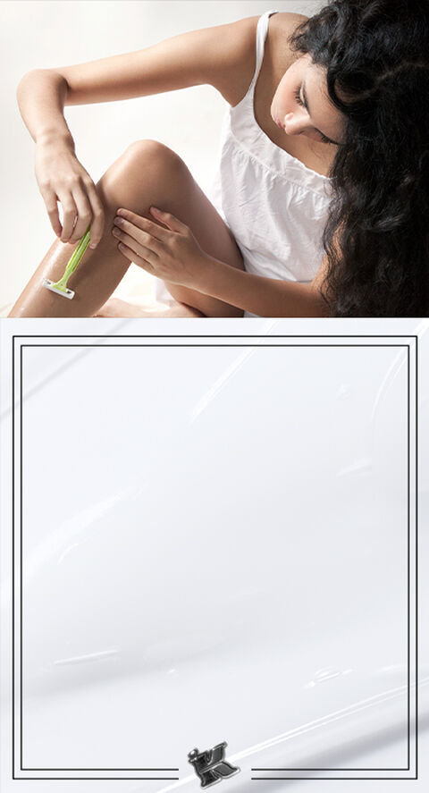 A person using a razor to shave their legs.