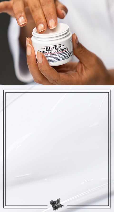 A woman rubbing her fingers into Kiehl's Ultra Facial Cream.