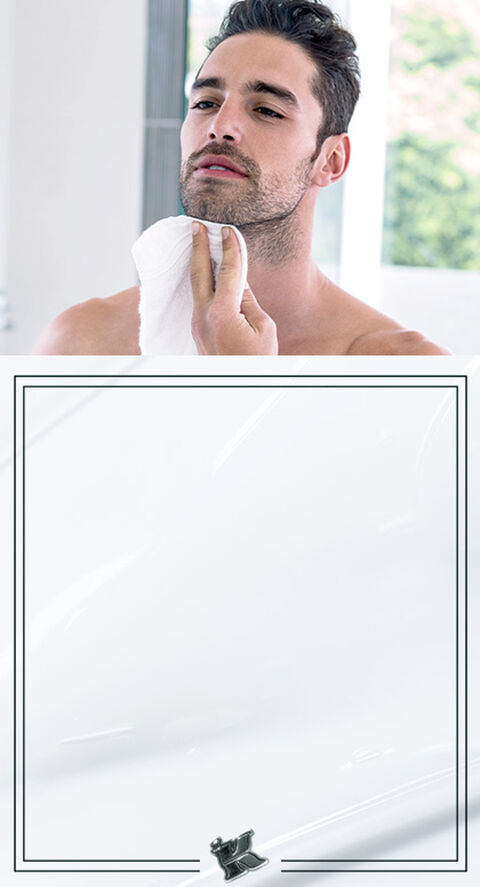 A man drying off his face.
