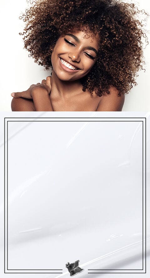 A woman with thick voluminous hair