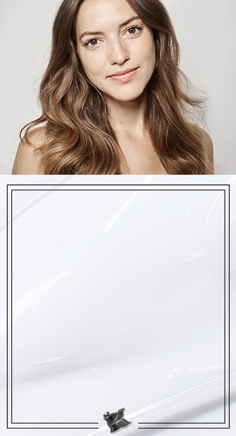 A photo of a woman with long brown hair