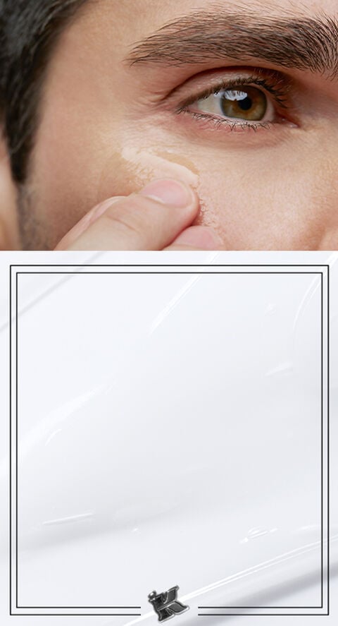 A man touching his face