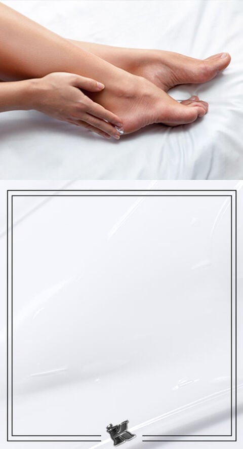 A person rubbing the bottom of their feet.