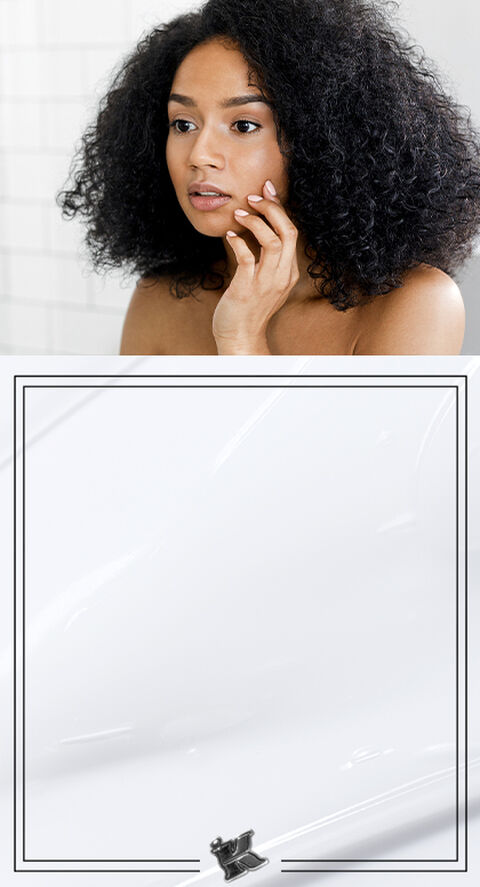 A woman touching her face