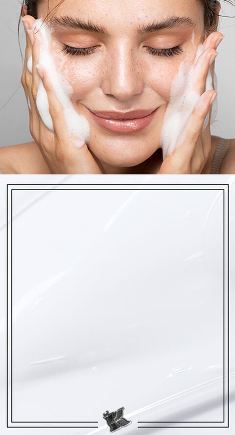 A woman washing her face with a foaming face wash