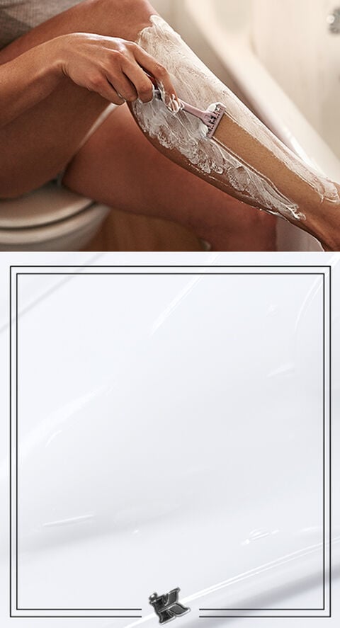 A woman shaving her legs